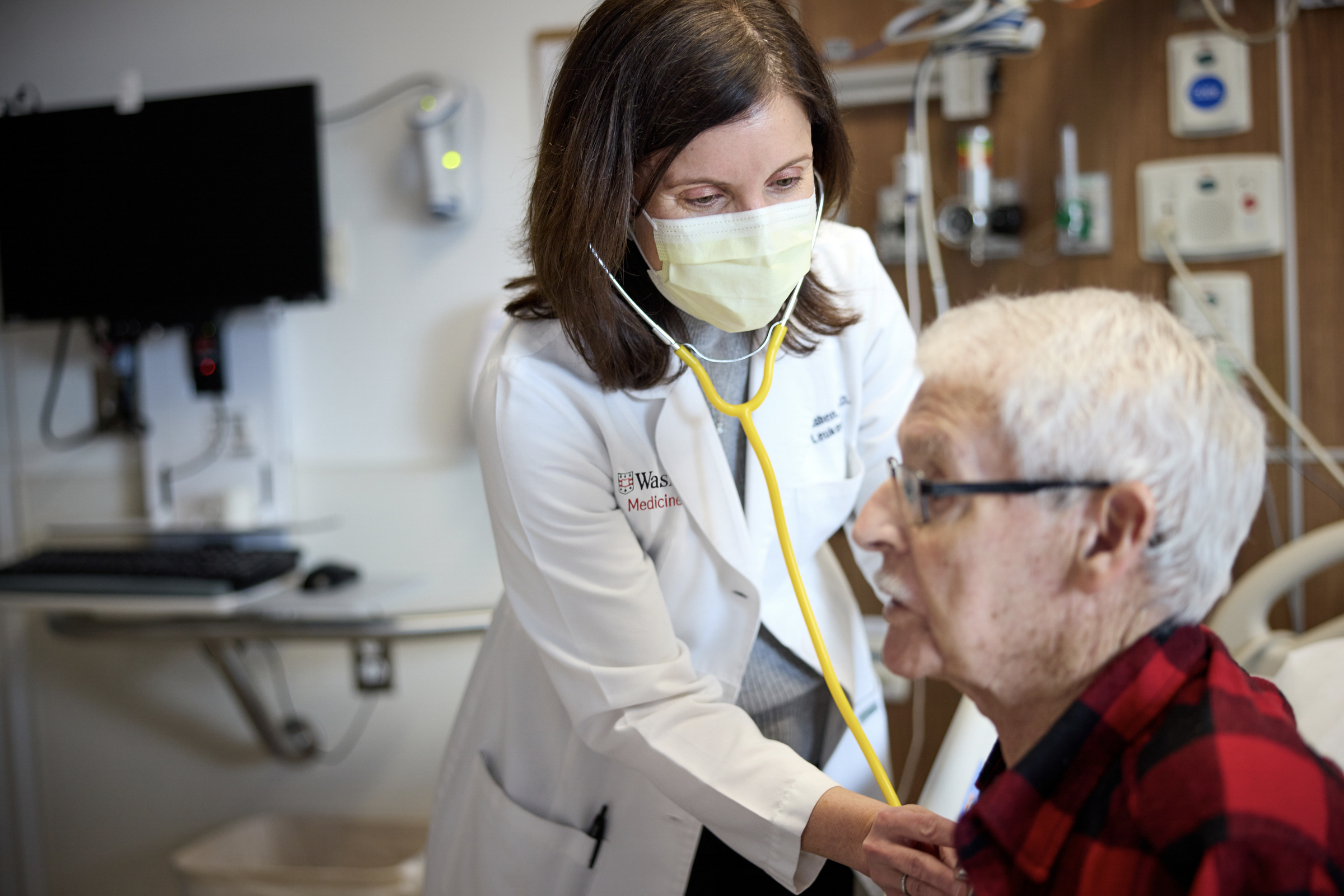 Doctor listening to a patient's heart
