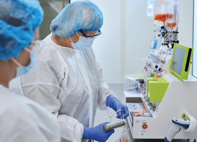 cancer clinicians in lab look at samples