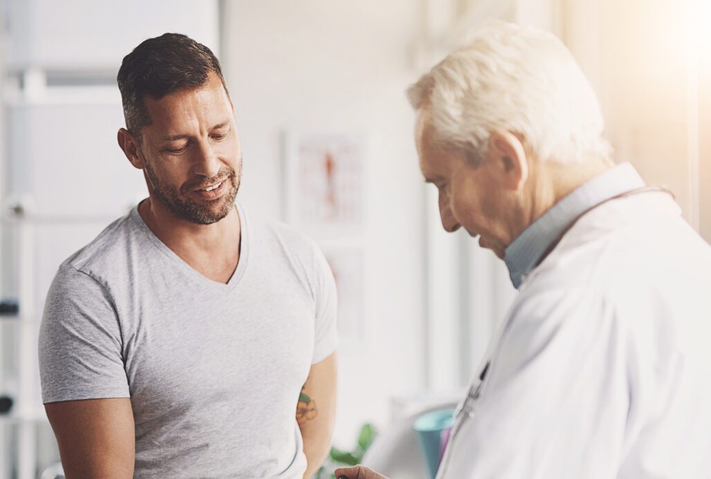 Doctor, man and patient in consultation